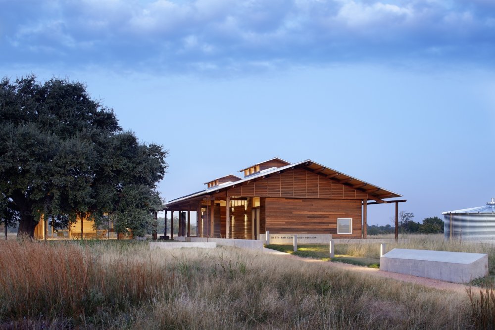 Nestled under a central oak tree, the open-air structure of the Betty & Clint Josey Pavilion provides a natural gathering space with expansive views of the surrounding landscape. Image courtesy of Dixon Water Foundation, Betty and Clint Josey Pavilion.